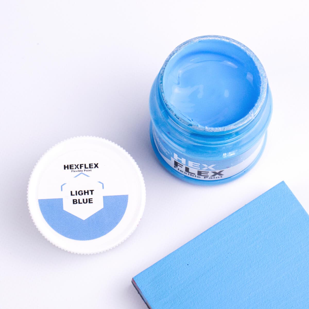 The bottle, cap and light blue HexFlex colour sample