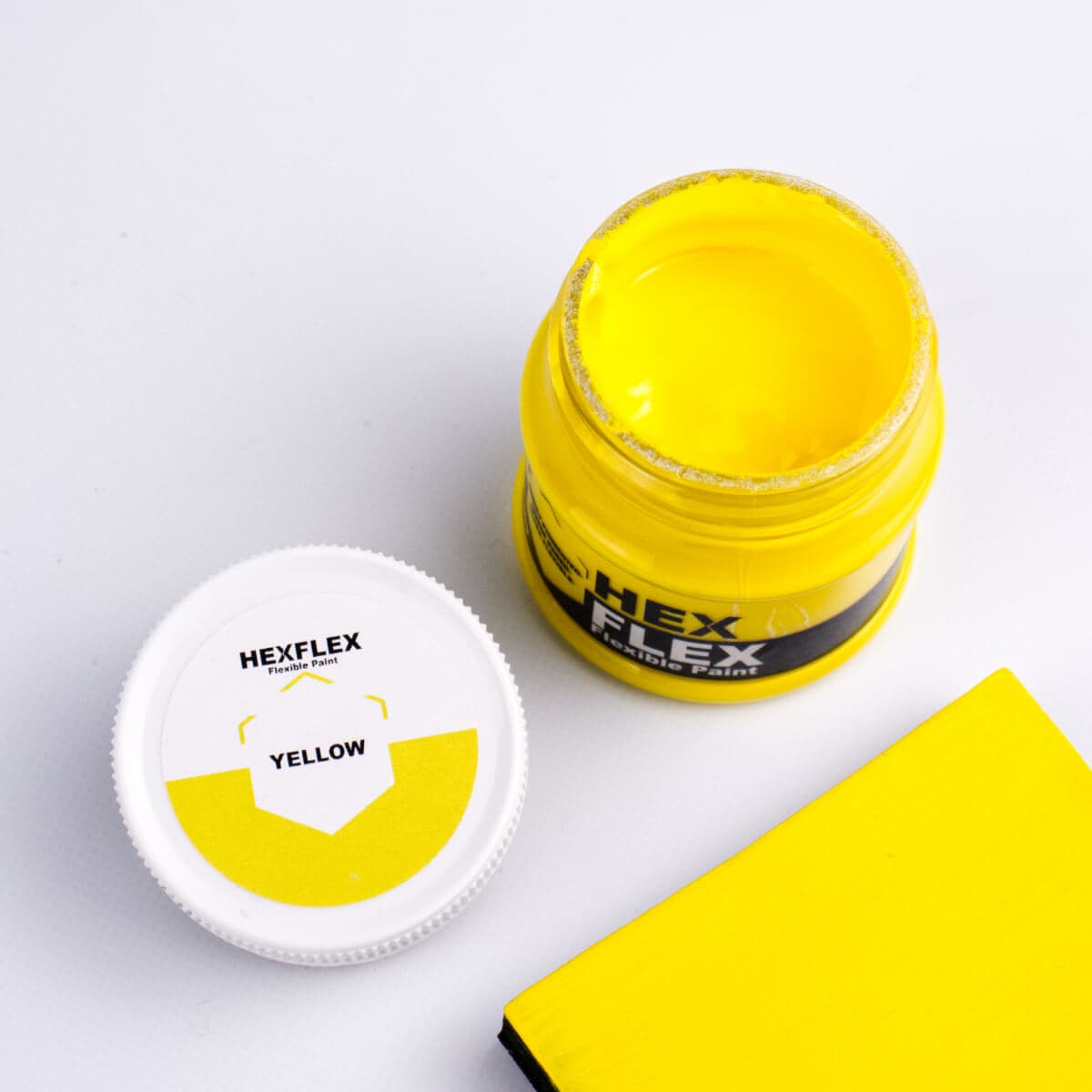 The bottle, cap and yellow HexFlex colour sample