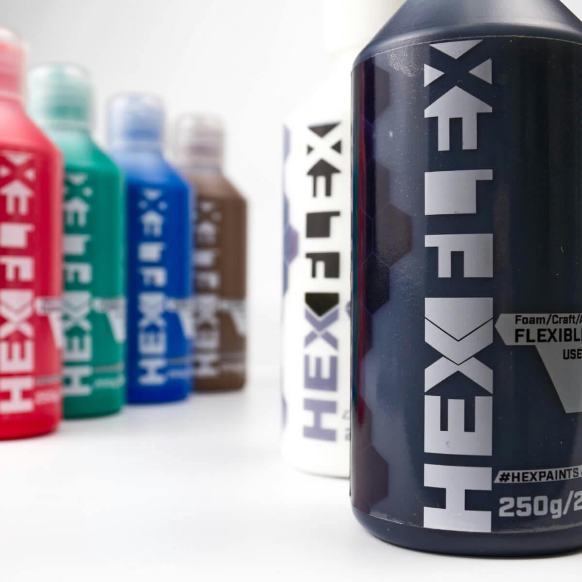 Close-up of HexFlex Primer in black with other colours in the background