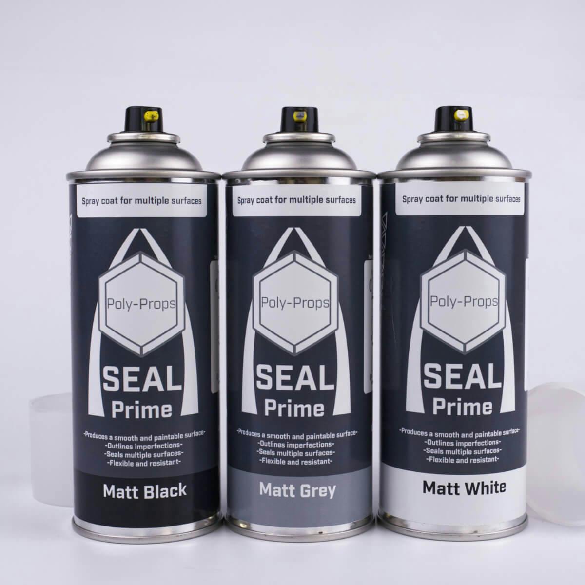 All colour variants of Seal Prime spray primer with caps off and nozzles on